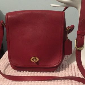Vintage leather red Coach Crossbody bag is.   # 9076 great condition.